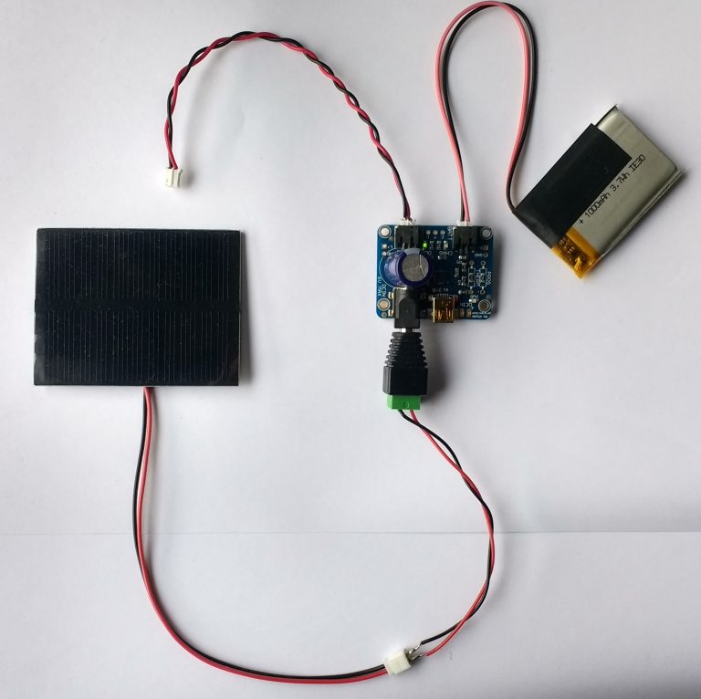 Figure 2. Adafruit solar charger with panel and battery connected. The unconnected lead powers the load - in this case an Arduino.