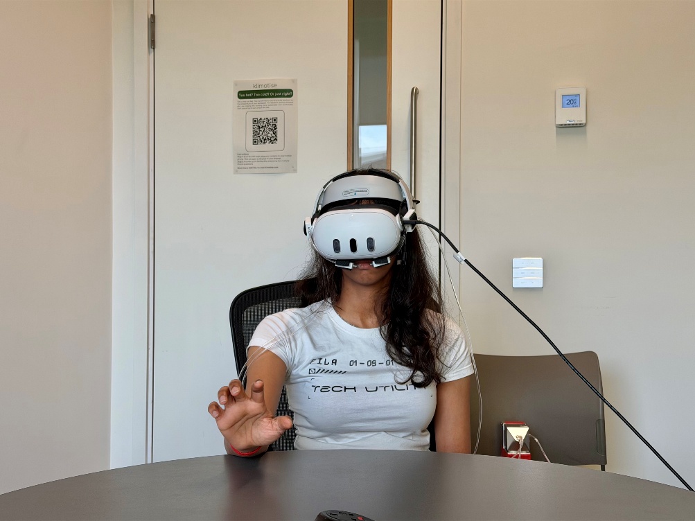 A participant wearing the scent-augmented VR headset while performing cognitive tasks.